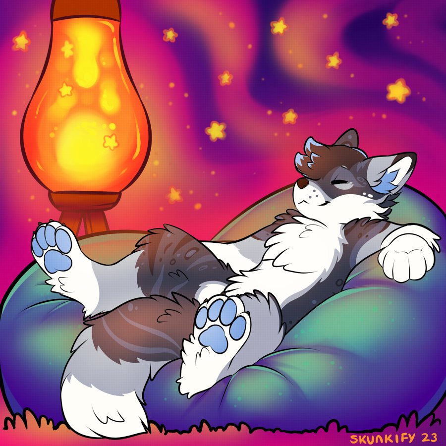 Older design with brown fur, napping in a beanbag next to a lava lamp
